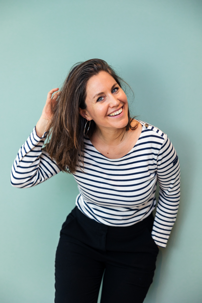 Jennifer Lacher smiling in a striped shirt