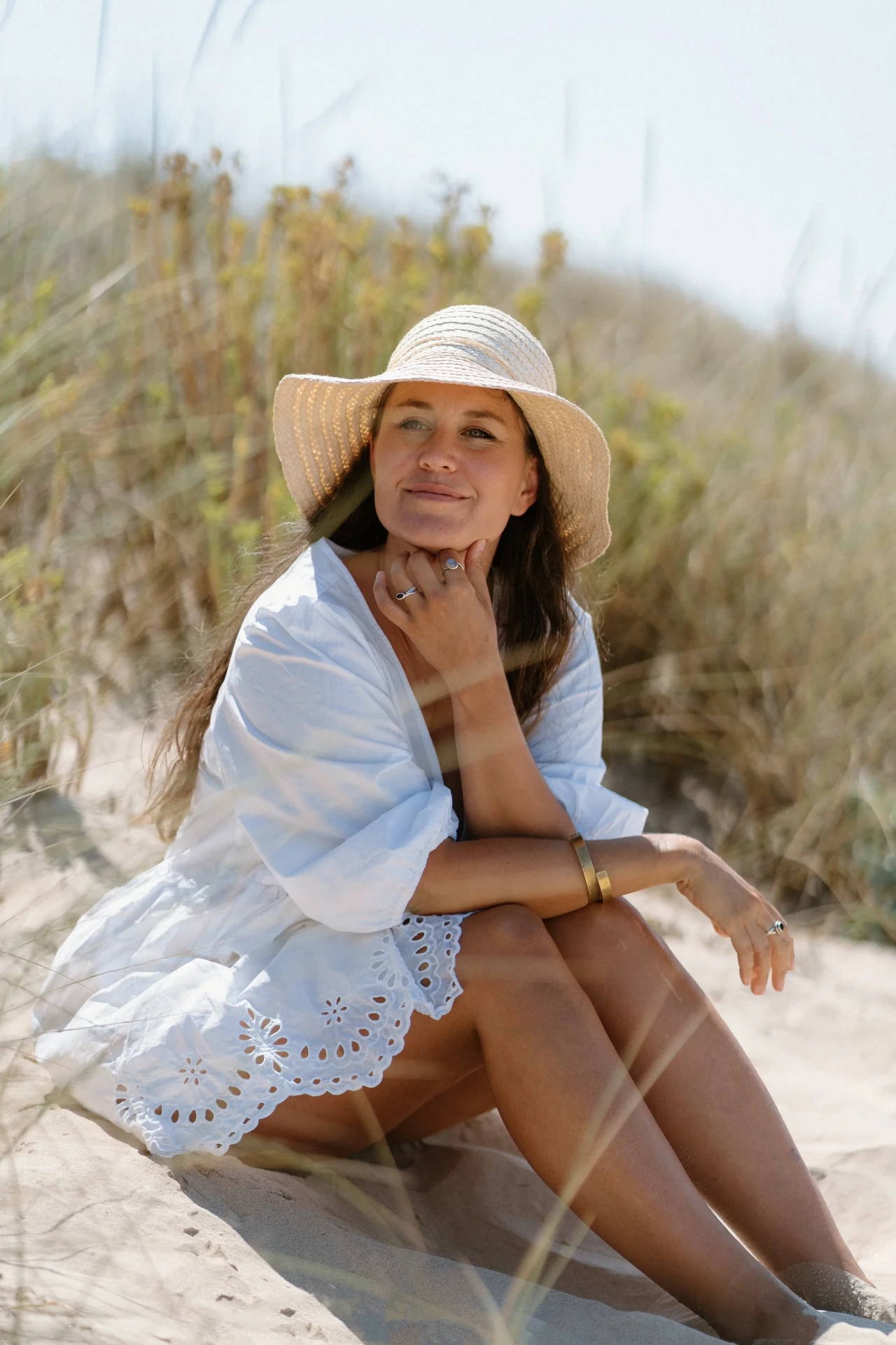Jennifer Lacher sitting in the dunes