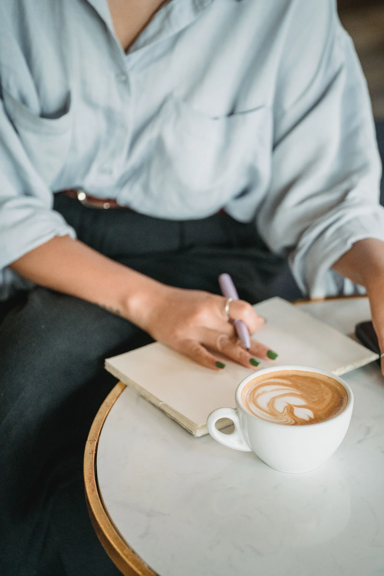 Journaling with coffee in a Lisbon café